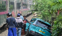 Puslabfor Dalami Penyebab Matinya Mesin Taksi Listrik Green SM di Perlintasan Kereta - GenPI.co