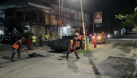 Perbaikan Jalan Rusak di Malang Dikebut, Warga Hati-Hati Melintas - GenPI.co Jatim
