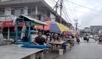 Gegara Banjir, Pedagang Pasar Babi Kota Singkawang Pindah Tempat - GenPI.co Kalbar