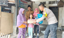 2 Jempol! Polisi di Lombok Timur Sisihkan Tunjangan untuk Bantu Anak Yatim - GenPI.co NTB