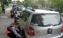 Ratusan Kendaraan Digembosi Karena Pakir Sembarangan di Pekanbaru - GenPI.co Riau