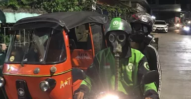 Cegah Corona, Driver Ojol Pakai Masker Antiradiasi