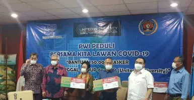 Lawan Corona, Gajah Tunggal Group Serahkan 50 Ribu Masker ke PWI
