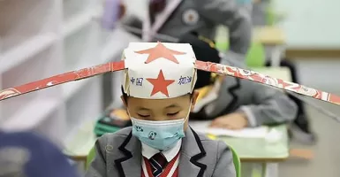 Setelah Lockdown Covid-19, Siswa China Sekolah dengan Topi Unik
