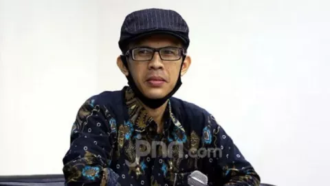 Ferdinand Desak Reshuffle, Ujang Sebut Beban Jokowi - GenPI.co