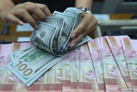 Dapat Kado Tahun Baru, Kurs Tengah Rupiah/USD Menguat - GenPI.co