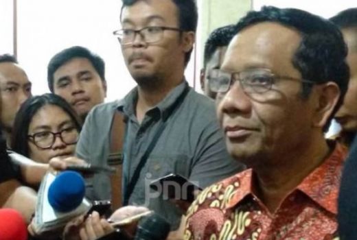 Menyoal Perppu KPK, Tak Ada Guna Berharap pada Pak Mahfud MD - GenPI.co