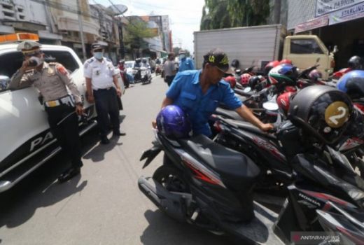 2 Jukir Liar di Madiun Diamankan Polisi, Tarik Tarif Lebih Mahal - GenPI.co JATIM