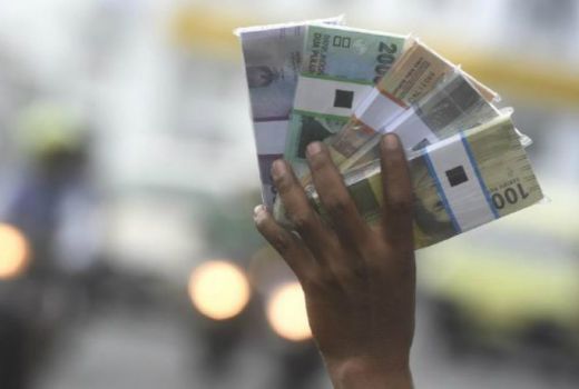 Begini Hukum Menjual Uang Tukar dalam Islam - GenPI.co