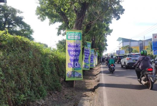 Pemkot Palembang Diminta Tertibkan Media Promosi di Pohon - GenPI.co SUMSEL