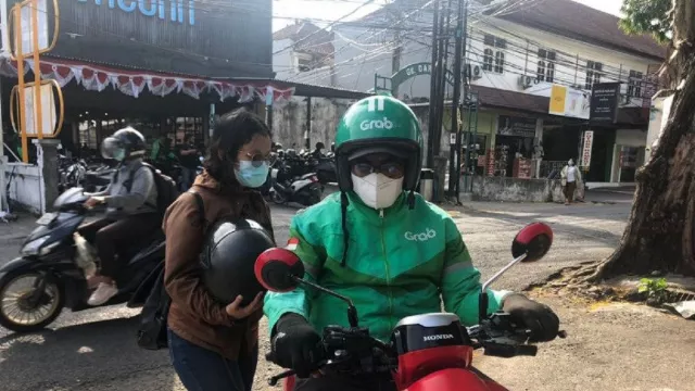Tarif Ojek Online Naik, Respons Driver Ojol di Bali? - GenPI.co BALI