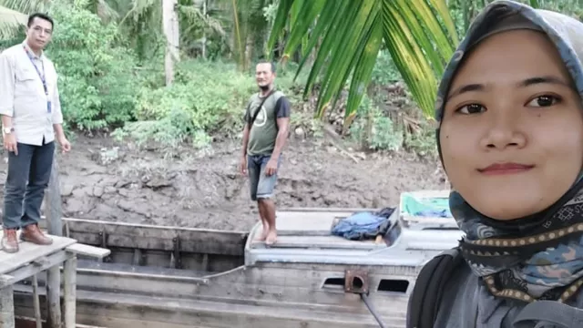 Resti, Mantri BRI Melayani Masyarakat Sungai Guntung - GenPI.co BALI