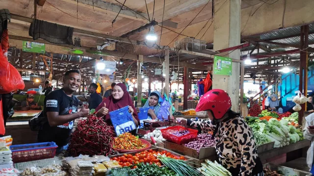 Hasil Positif Edukasi Transaksi Digital UMKM Di Pasar Hamadi Papua - GenPI.co BALI