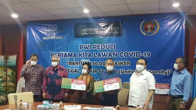 Lawan Corona, Gajah Tunggal Group Serahkan 50 Ribu Masker ke PWI - GenPI.co