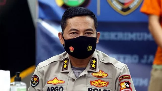 Polisi Tetapkan Ambroncius Nababan Tersangka Penghina Pigai - GenPI.co